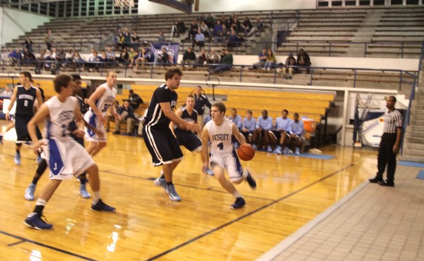 From a game earlier in the season, senior Sean Tillery (4) drives to the basket and scores two for the Jays.  