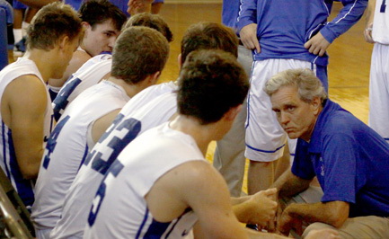 Coach Chris Jennings speaks to his team during a timeout. 