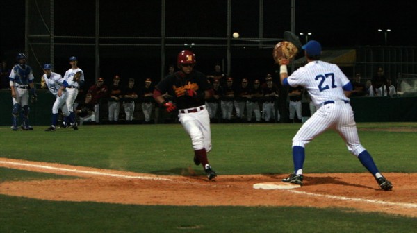 A Crusader tries to reach base on a bunt, but junior catcher Spencer Miller (15) makes a quick play on the ball and throws to senior first baseman Dylan Weston (27) for the out. Jesuit will attempt to rebound from Wednesday’s 8-1 loss to Brother Martin when the two squads play again on Friday night at John Ryan Stadium.