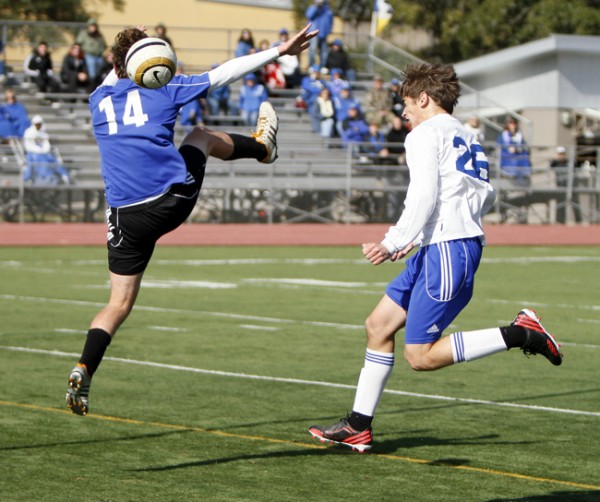 Junior Jacob Stansberry heads the ball past the defender and goalie for his second goal of the match. 