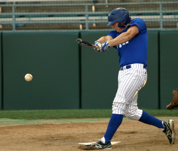 Trent Forshag’15 grounds a pitch into the gap Friday, June 7, 2013 during the 4-2 victory against Ponstein’s Grocery at Kirsch-Rooney Stadium.  