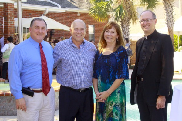 Principal Mike Giambelluca (left) and Fr. Raymond Fitzgerald, S.J. visit with the gracious 2012 Mothers' Coffee hosts, Sam and Jackie-Sue Scelfo.