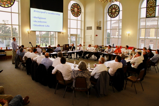 Principal Peter Kernion ’90 (standing left) made a presentation to the President’s Advisory Council (PAC) at the group’s recent meeting in St. Ignatius Hall.
