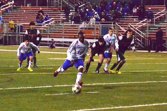 Senior Jordan Rice (left) scores Jesuit’s only point, a penalty kick, in the 1-1 tie against Ben Franklin at Pan-American Stadium Wednesday evening (November 14). 