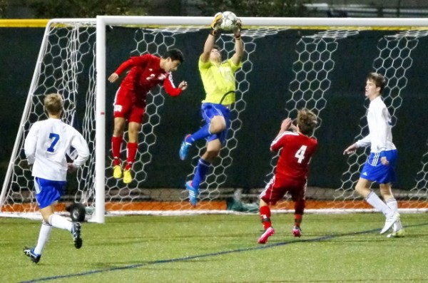 Junior goalie Nick Tadros, who came off the injured reserve list to make his first start this season for the Blue Jays, leaps high for this great save during Friday night’s (December 14) match against Archbishop Rummel at John Ryan Stadium.