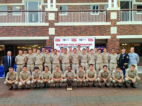 Members of the 2012-13 varsity soccer team, along with their coaches and a representative from the Army National Guard, gather in the Traditions  Courtyard prior to Monday’s Assembly (April 8) at which the Blue Jays  were presented with a national ranking trophy. It was the latest honor  on top of winning the LHSAA Division 1 State Championship. 