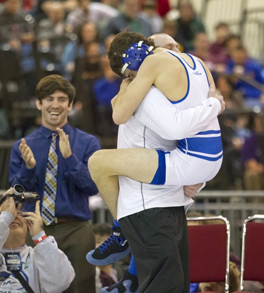 Jesuit's Mitch Capella (113) celebrates his championship win with assistant coach Gregg Romano Saturday, Feb. 6, 2013, during the state championship wrestling tournament at the Pontchartrain Center.