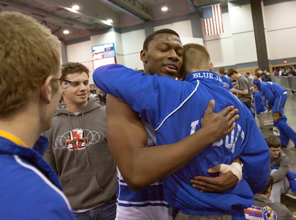 Manny Armour (195) celebrates his championship win with teammates Saturday, Feb. 6, 2013, during the state championship wrestling tournament at the Pontchartrain Center.