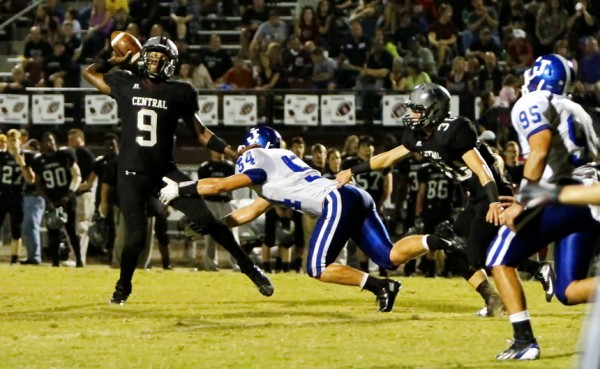 Linebacker Colby Simoneaux bursts through the offensive line to put some hurry-up heat on the Wildcats' quarterback.