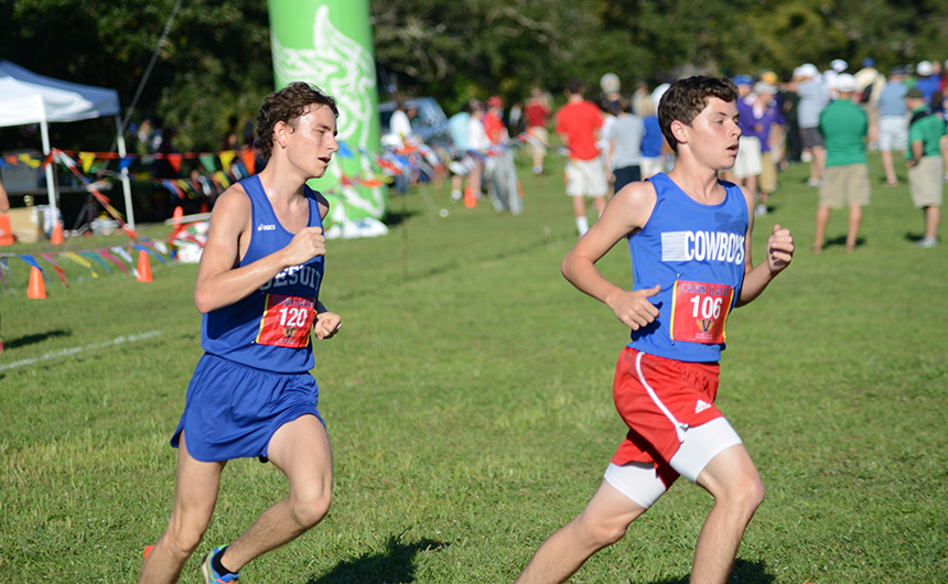 Senior Liam Fitzgerald (left), who took second place overall, makes a move toward the front of the pack at the Saturday, Oct. 12 Country Day Classic at City Park.