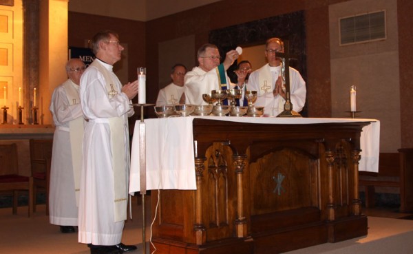 Archbishop Gregory Aymond celebrates Mass in the Chapel of the North American Martyrs with the Jesuit school community.
