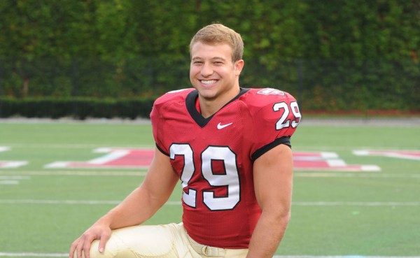 Harvard University sophomore Paul Stanton, Jr., a 2012 Jesuit alumnus, ran for two touchdowns in overtime to help the Crimson down Holy Cross.