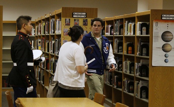 Sophomore William Waguespack leads his tour group through the Resource Center as part of Open House.