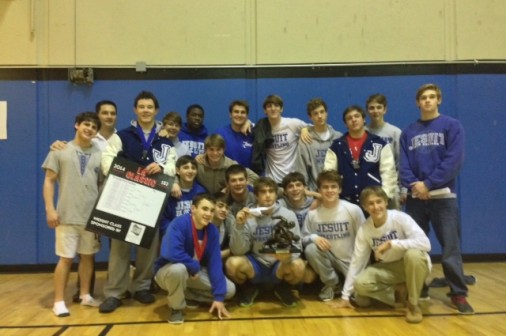 The Wrestling team poses with their Louisiana Classic trophy. Photo courtesy of Colleen Charles.