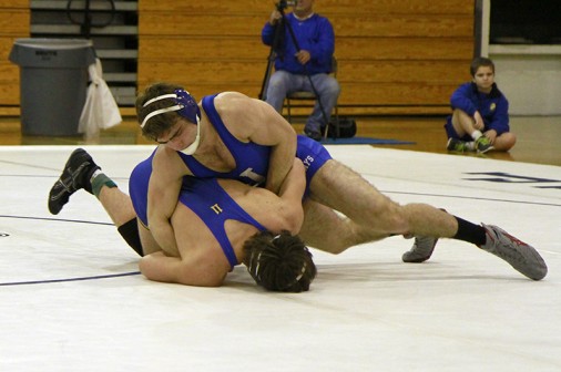 Senior Gaston Eymard (160) defeats his opponent at the St. Paul's dual meet on Wednesday, Feb. 13 in the Birdcage. The meet was especially memorable for Eymard and four of his classmates as it was their last home meet as Blue Jay wrestlers.
