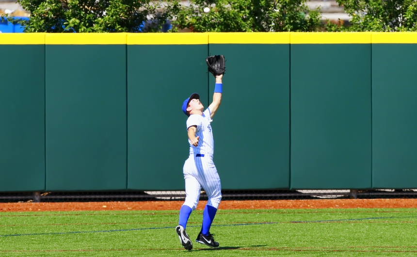 Scott Crabtree makes it look easy catching this fly ball on the run in left field in the Jesuit - St. Michael's game on Saturday afternoon at John Ryan Stadium.
