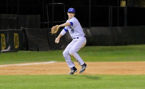 Jesuit third baseman Spencer Miller throws to first base for an out. In addition to his excellent fielding, Miller is a superb hitter batting in the clean-up spot.