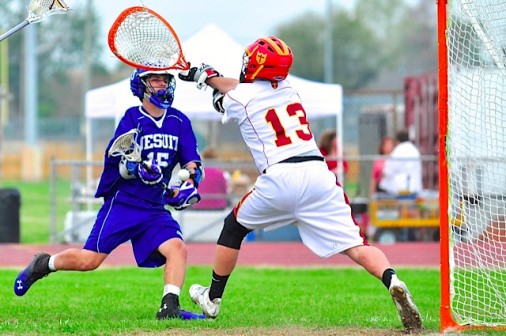 Sophomore Max Murret goes low for one of his two goals against Bro. Martin on Saturday, March 22.