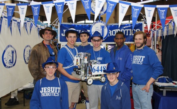 Members of the Robotics Club pose with their robot at their Jesuit headquarters at the FTC South Super Regionals on Feb. 26-28, 2014.