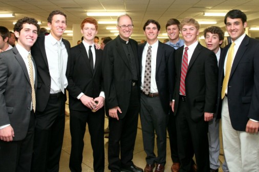 Seniors Alex Brewster, Brandon Dequeira, Dalton Steiffel, Nathan Zimmer, Luke Hahn, Will Tebbe, Jack Hebert and Chase Eckholdt join Fr. Raymond Fitzgerald, S.J. for a reception in the Student Commons following the 2014 Baccalaureate Mass.