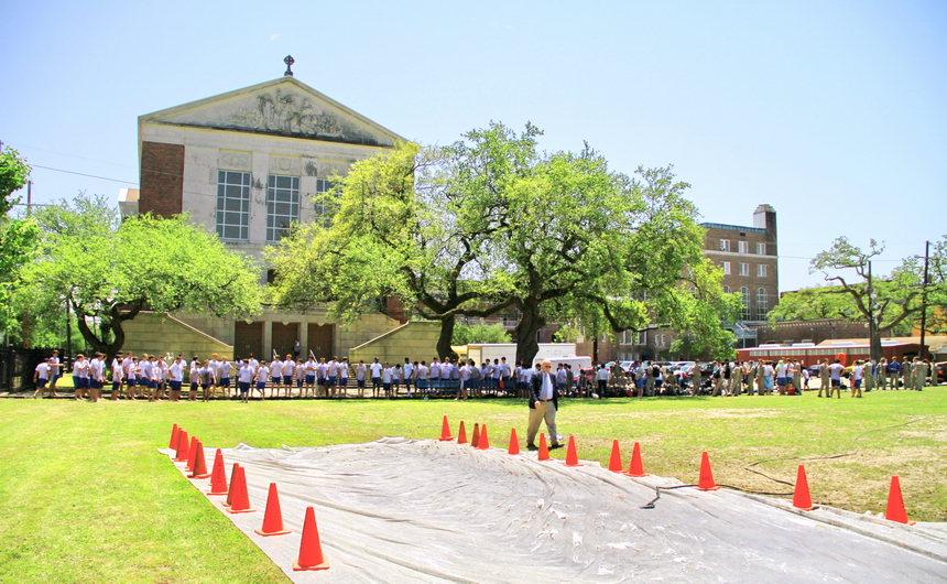Prefect of discipline Mr. Top Abshire walks to his water hose station from where he can easily supervise the eager upperclass-Jays already llined up to participate in the Extreme Slip 'n Slide, the fun and crazy activity on Wednesday during Senior Week.
