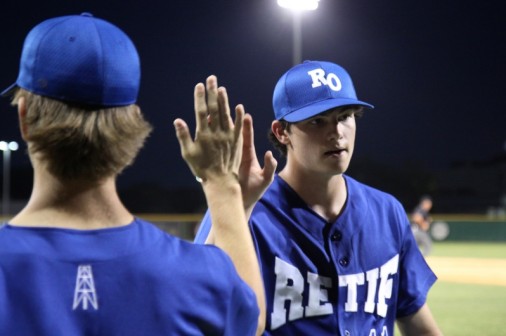Pitcher Jack Burk gets a high-five from fellow hurler Joey Latino after giving up just a single run in a 15-7 victory o ver Peake BMW on Monday, June 9.