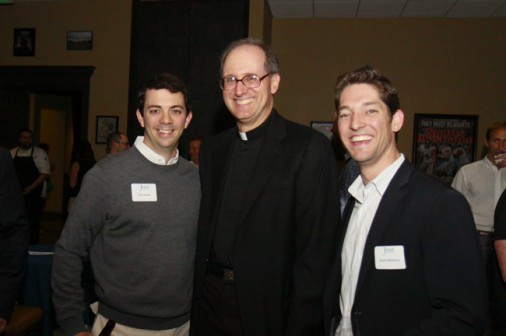 Billy Guste and Scott Helmers visit with Fr. Raymond Fitzgerald, S.J. at the Class of 1998 Couples' Reunion in 2013.