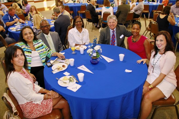 Six plus one: alumni director Mat Grau '68 (third from right) plants himself in the middle of this table of new parents; clockwise, from left: Christine Dupre, Liz and William Bostick, Louise Bellazer, Kimberly Francis, and Jennifer Demarest.