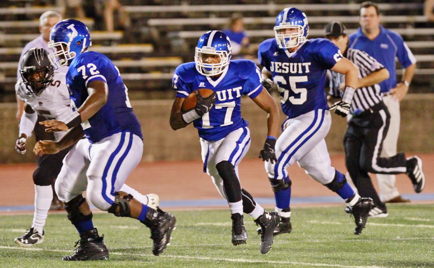 The Jays have a potent threat in junior wide receiver Kalija Lipscomb, shown here on the way to the end zone in last week's game against Central High (Baton Rouge). Acting as bodyguards are junior Austin Reed (72) and senior Brad Gaudet.