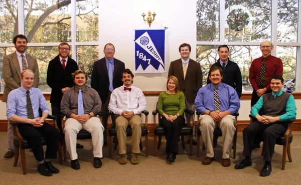 Jesuit's new faculty members for the 2014 - 2015 school year are, seated from left: Alumni Service Corps members Charles Bourg, Matthew Firmin, and Tim Harris, all from the Class of 2010;  Jennifer Buuck, Tim Falter '02, and Justin Genovese; standing, from left: Nicholas Simoneaux '05, Donald Songy '07, Mark Songy, Wade Trosclair '07, Greg Uddo '00, and John Webre.