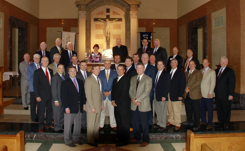 The leadership team for the current (2014-15) PAG drive, along with several chairmen of previous drives, attended Mass on Sunday, September 14 in the Chapel of the North American Martyrs. Front row (from left): 2015 PAG drive chairman Gerald Duhon ’85 with senior class tri-chairs Eric Simonson ’82, Skip Crabtree, and Gene Simon ’80;  Second row: junior class tri-chairs Geary Mason ’79, Eric Derbes ’83, and Phillip Nimmo; sophomore class tri-chairs Rocky Daigle ’85 and Kelly Parenton ’90; freshmen class tri-chairs Tom Leonhard ’85, René Alvarez ’83, and Rick Kuebel ’82; pre-freshmen class tri-chairs Mike Varisco ’83, Walter Bond ’85, and Tony Toups ’81;  Third row (with the year they served in parenthesis): former PAG chairmen Mike McGlone ’68 (1995), Tom Kitchen ’65 (1992), Mike Nolan ’63 (1991), Stanton Murray ’81 (2010), Brian North ’83 (2013), and Tom Bagwill (2008), who is director of Jesuit’s office of institutional advancement;  Back row: former PAG chairs Terry Billings ’74 (2012), Ken Adolph ’59 (1985), Ed Vocke ’59 (1993), Billy Guste ’66 (1998), Patricia Gillen (widow of Jerry Gillen ’54, who served as chairman of Jesuit’s first PAG drive in 1975-76), Jesuit President Fr. Anthony McGinn, S.J. ’66, Marc Cousins ’74 (2014), Harry Block ’72 (2002), Paul Bonitatibus (1989), and Bill Steen ’68 (2011). Not pictured is sophomore class tri-chair Bryon Hatrel ’84.