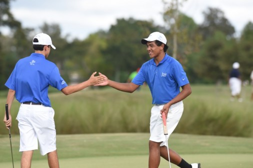 Senior Colin Hery (left)  and junior Carlo Carino celebrate a district win over Archbishop Rummel on Wednesday, Oct. 1, at Lakewood Golf Club.