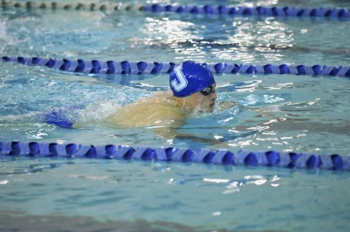 Junior Cade Fuxan (pictured here at the Holy Cross meet) helped lead the Jays with one individual first place and two relay first place performances.