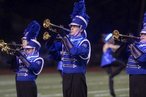 Freshman Robbie Beyer and other members of the Blue Jay Band trumpet section blast their way through the 2014 District VI Marching Festival at Joe Yenni Stadium.