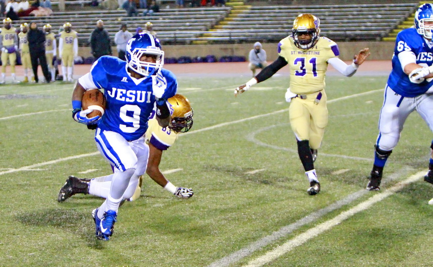 Charles Jackson picks up a first down against St. Augustine in Friday's opening playoff game at Tad Gormley Stadium. Jackson had 12 carries for 111 yards and a touchdown. 