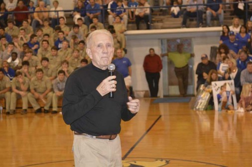 Billy Murphy, head coach of Jesuit's 1978 state runner-up team, addresses the crowd at Thursday night's pep rally.