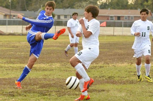 Chase Rushing wields a dangerous weapon - his foot - in the match against Archbishop Shaw.