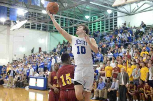 Senior Paul Kohnke drives for two of his eight points in the Jays' tough loss to Brother Martin 50-36.