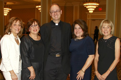 Fr. Raymond Fitzgerald, S.J. '76 with this year's honorees: Rhonda Eckholdt, Marsha Cropper, Joan Gogreve, and Anne Barnes.