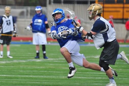 unior Jacob Buuck goes airborne to launch a a shot on goal against Jesuit Dallas College Prep.
