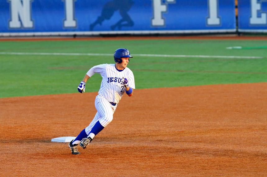 Scott Crabtree rounds 2nd base on his way to an RBI triple against John Curtis in game 2 of a double-header for Jesuit in the Gerard Oubre Memorial Tournament on Friday, March 20 at John Ryan Stadium. 