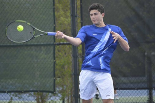 Senior singles specialist Alex DePascual rockets a forehand against Country Day on Tuesday, March 31.