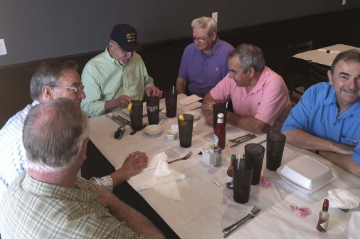 Wearing his Navy hat, David Lester celebrates his 74th birthday with his 1959 Jesuit classmates. The monthly luncheon took place at Porter & Luc in Metairie on Wednesday, March 18.