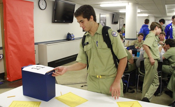 Junior Michael Pou submits his vote during  in the ballot box during lunchtime voting on Tuesday. Tuesday's vote led to a run-off for the office of secretary. A tie in the run-off has forced another election, giving Jays an unprecedented third opportunity to vote -- this time on Wednesday, April 1.