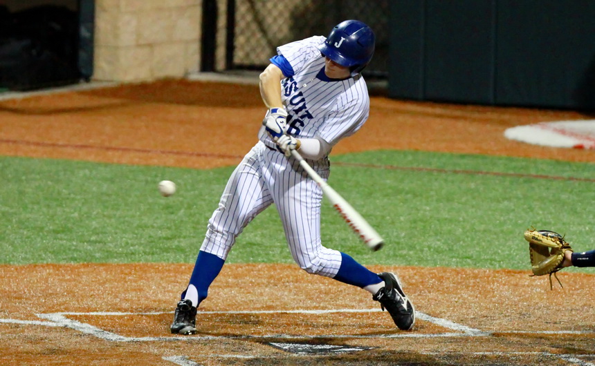 Dan Edmund hits this pitch for a double that drove in two runs in Jesuit's game against Holy Cross Friday evening at John Ryan Stadium.
