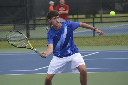 Junior Jacob Niehaus prepares to end a doubles point with a poach on Tuesday, April 9.