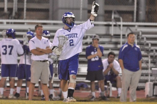 On senior night, midfielder Michael Simon signals a play to his teammates. The Blue Jays closed out the regular season with a 14-2 victory over Brother Rice (Chicago, IL). 