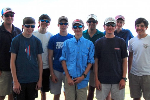 Members of the Jesuit sailing club are pictured: (front row, from left) William Nance, Robert Argote, William Breaux, and Jackson Bauer. (Back row, from left) Charlie Singer, Coach, Connor Housey, Michael Haupt, Jonathan Pottharst, and Max Bell.