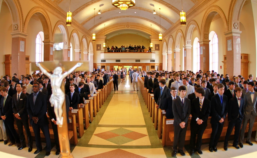 Following the Seniors of 2015, the faculty of Jesuit High School process into the Chapel of the North American Martyrs for the Baccalaureate Mass on Saturday, May 16.