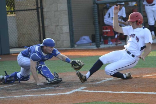 Retif Oil catcher Trent Forshag lunges to tag a Columbia, Tennessee, runner at the plate. 